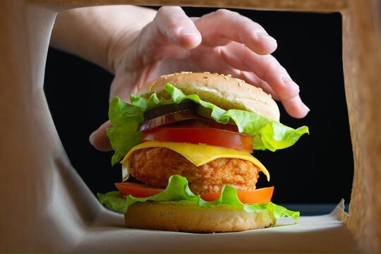 Chicken Burger In Paper Bag Package.Fast Food For Breakfast.Junk Food 