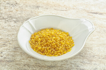 Raw bulgur in the bowl