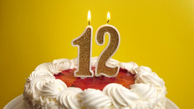 A candle in the form of the number 12, inserted into the holiday cake, is blown out. Celebrating a birthday or a landmark event. The climax of the celebration.