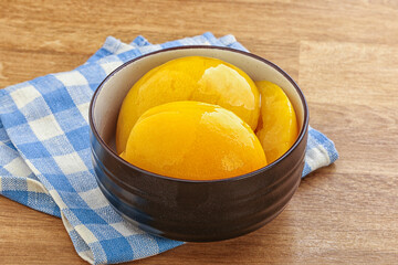 Sweet canned peaches with syrope