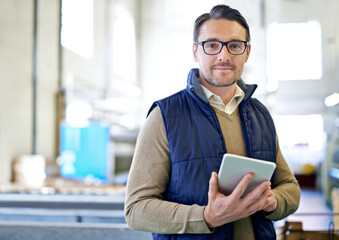 Tablet, manager and portrait of man in factory for manufacturing, networking and inventory. Distribution, industrial and technology with male employee in warehouse for inspection, export and storage