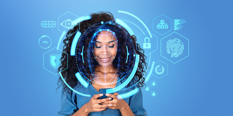 Smiling African woman using smartphone with facial recognition interface
