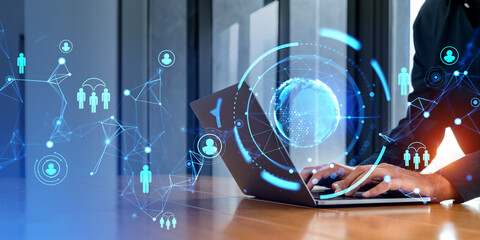 Businessman with smartphone and computer, earth sphere and social network icons