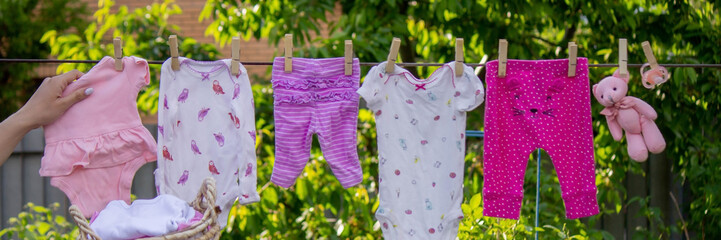 washing baby clothes. Linen dries in the fresh air. Selective focus.