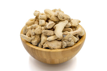 Dried Organic Ginger root isolated on white background. Ginger root or Dry Adrak in wooden bowl