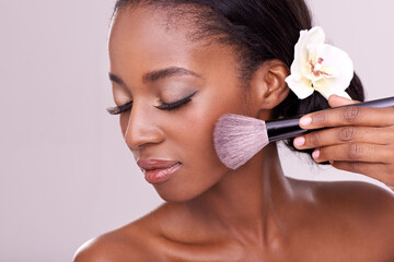 Cosmetic glow, makeup brush on face and black woman with skincare in studio, cosmetics tool. Skin...