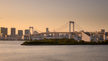 Tokyo city and rainbow bridge view from Odaiba. sunset view in Tokyo bay. famous tourism attractions destination in Japan. evening time twilight scene.