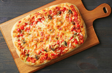 Freshly Baked Homemade Pizza Alla Pala on a Wooden Breadboard