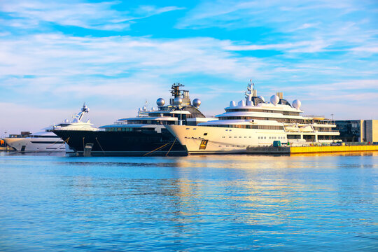 Millionaire yachts on the harbor . Berth with Nautical Vessels