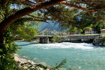 Nice sunny day. No people are seen. Swiss bridge over the Reuss river