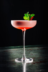 alcoholic cocktail in a glass stands on a table in a bar or restaurant