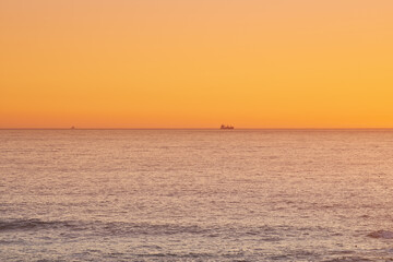 Sky, sunset and sea at night on the horizon with ocean and waves landscape. Sunrise background, calm weather and summer by the beach with coastline and outdoor environment with mockup in nature