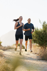 Morning, fitness and couple trail running as workout or morning exercise for health and wellness together. Sport, man and woman runner run with athlete as training in nature for sports or energy
