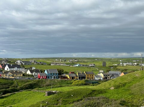 An old Irish village, cast in a landscape with cows