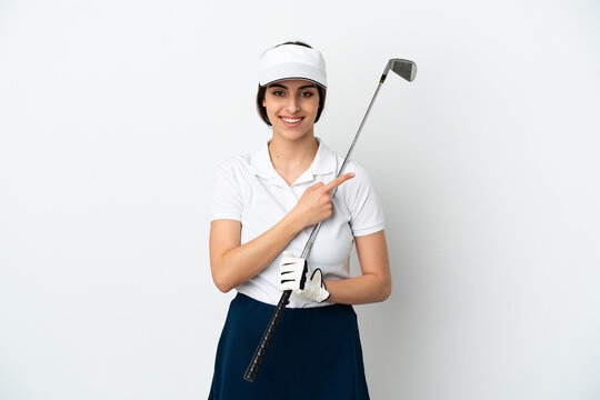 Handsome young golfer player woman isolated on white background pointing to the side to present a product