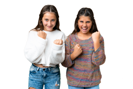 Friends girls over isolated chroma key background celebrating a victory