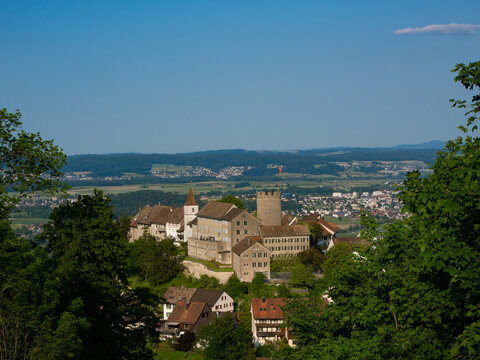 Historic Medieval Castle of Regensberg near Zurich with Stone Tower and Wall against Blue Sky Background. View from Above. Landscape format.
