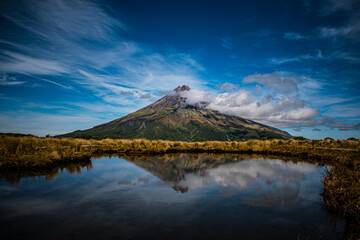 New Zealand, Mount Taranaki is the symmetrical volcanic cone that rises from sea level to 8,260 ft (2,518 m). This mountain is located in Egmont National Park, North Island of the New Zealand.