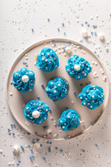 Tasty and sweet cupcakes with flower shaped cream.