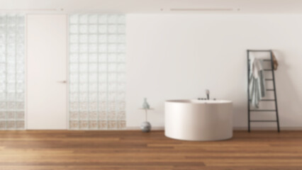 Blurred background, minimal bathroom with round bathtub and decors. Glass brick walls, ladder towel hanger and parquet. Modern interior design idea with copy space
