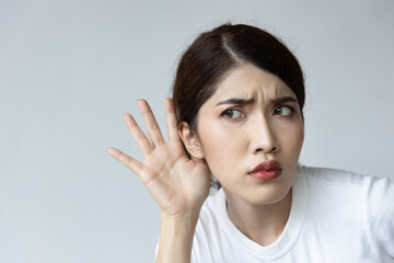 woman listening to something, portrait of asian woman with hearing ear, concept of rumor, gossip,...