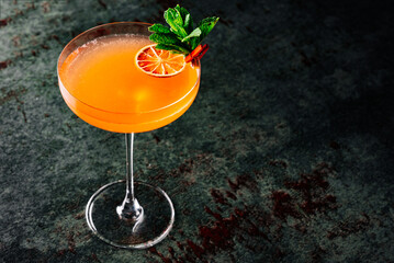 alcoholic cocktail in a glass stands on a table in a bar or restaurant