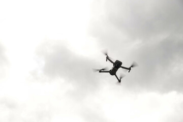  September 10, 2022, Carpathian Mountains, Ukraine. quadrocopter Mavic flies against a gray cloudy sky. Blur and selective focus.