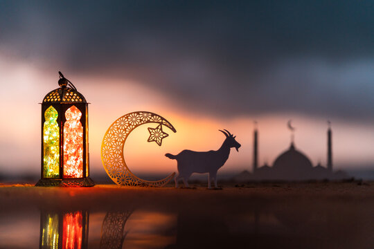 Eid Mubarak background, Traditional Ramadan lantern lamp with crescent moon and goat, New  Eid Al Adha image