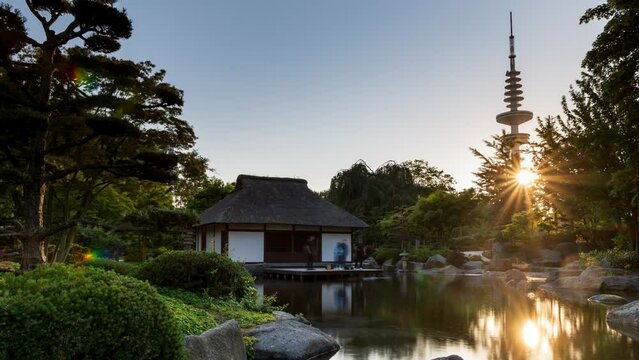 Hamburg, Germany: sunset at Japanese teahouse in the city park "Planten un Blomen"