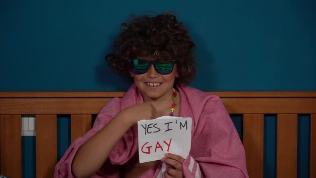 8-year-old boy child says  yes, I am gay - Outing o coming out concept - LGBT free people - 
gay pride and defense of the rights of the homosexual and bisexual community