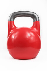Naklejka na ściany i meble Classic cast iron kettlebell painted red and shot in a white studio.