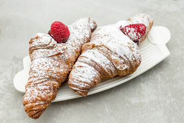 Croissants with jam and berries