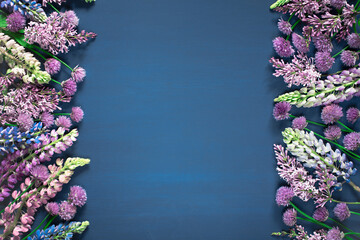 Fototapeta na wymiar Floral blue background, frame with fresh flowers
