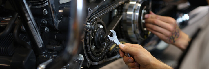 Maintenance of motorcycle engine clutch system by technicians. Repair and diagnostics of motorcycle...