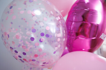 A bunch of colorful latex balloons with helium.