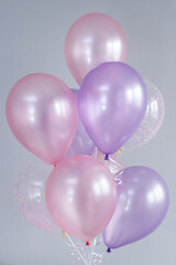 A bunch of colorful latex balloons with helium.