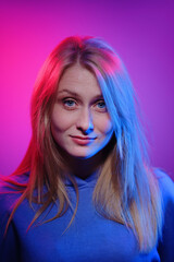 Colorful close-up studio portrait of a young woman