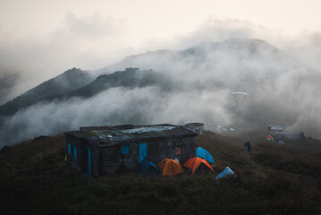 Sunrise at Sunset peak in Hong Kong with House in front