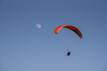 Player flying towards the moon with blue sky