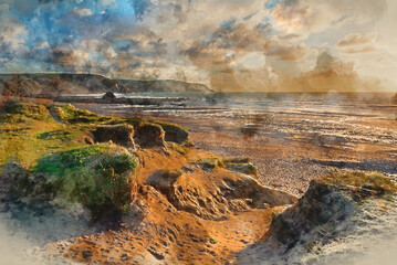 Digital watercolour painting of Stunning Summer sunset landscape image of Widemouth Bay in Devon England with golden hour light on beach