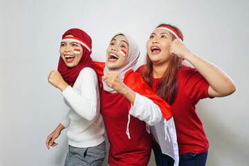 happiness of a group of young people using the red and white attributes to commemorate independence day