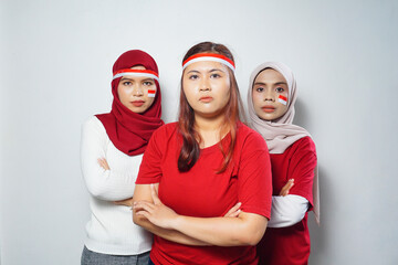 Fototapeta premium happiness of a group of young people using the red and white attributes to commemorate independence day