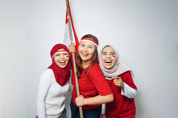 happiness of a group of young people using the red and white attributes to commemorate independence...