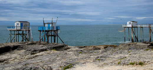 Fototapeta na wymiar Stilt fishing huts facing the ocean near Royan