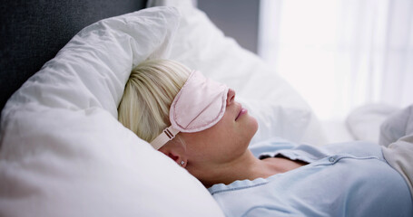 Obraz na płótnie Canvas Young Woman Sleeping With Sleep Mask