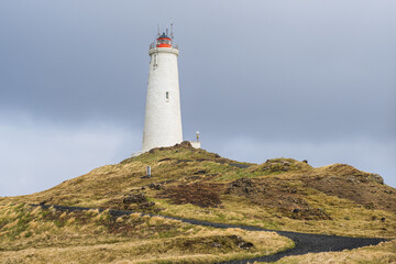 Fototapeta na wymiar Lighthouse at Reykjanesbaer in Iceland in summer