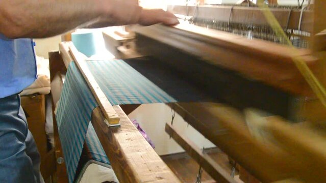 hand woven textile loom working