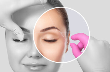 The make-up artist plucks eyebrows with a thread close-up. Women's cosmetology in the beauty salon.