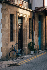 Fototapeta premium Tranquil City Alley with Lonely Bicycle and Calming Architecture.