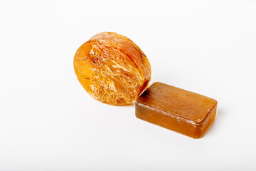 Handmade natural yellow herbal soaps on a white background. Copy space. Soap bars. Skin care treatment. Spa close-up